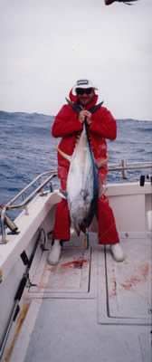 Dave Venn an his 36 Kg Yellowfin Tuna caught by a “Slimy Rocket” lure, aboard Born Free.