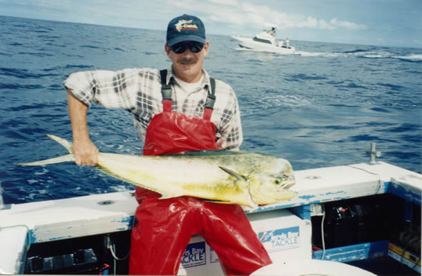 Dave Venn with his 8 Kg Mahi Mahi caught by using a “Purple” “Rocket”. Boat - Reel Quick.