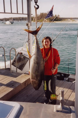 Maria Carnevale with her 43 Kg Yellowfin was captured using a “Lumo” “Little Dingo” lure.