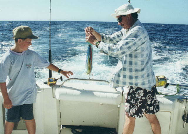 Dave Venn showing Fletcher Scott how to peg a JB Lure on "Starfish", Feb. 2001.